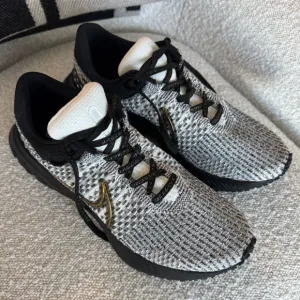 Nike Athletic Shoes Black and White with Gold Accents