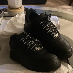 Supreme Black Athletic Shoes with Rugged Design