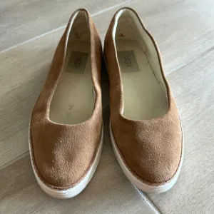 Ugg tan suede slip ons shoes with sneaker sole in great condition